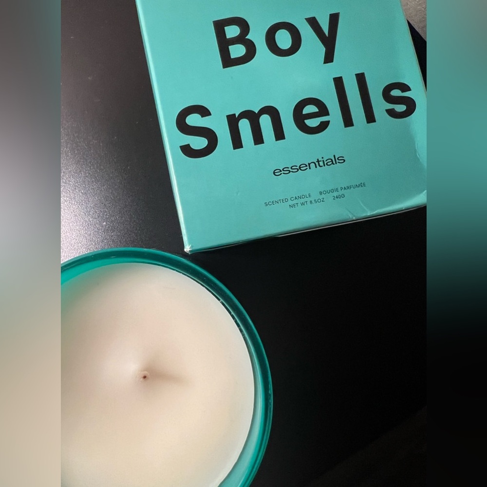 Boy smells herbaceous candle